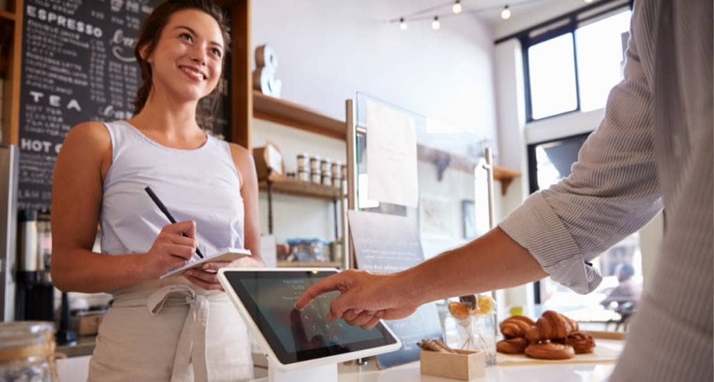 Online college student working as a Barista at a coffee shop