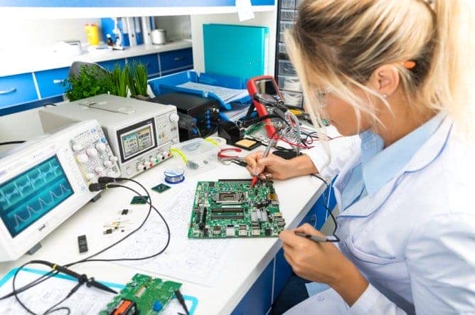 Electrical Engineer working on electrical system in lab