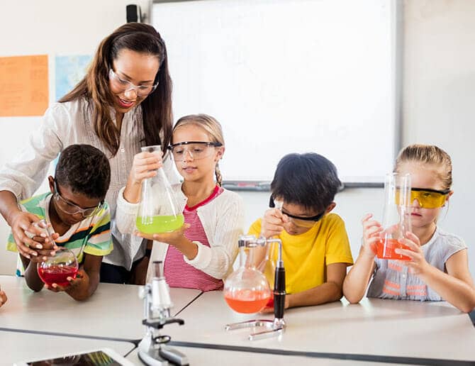 Teacher and students doing experiments in a STEM class