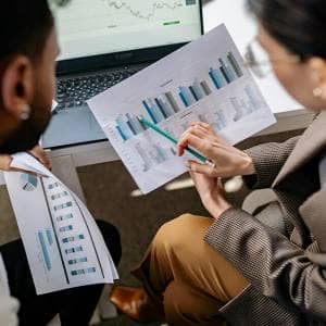 Business Analyst Reviewing Charts