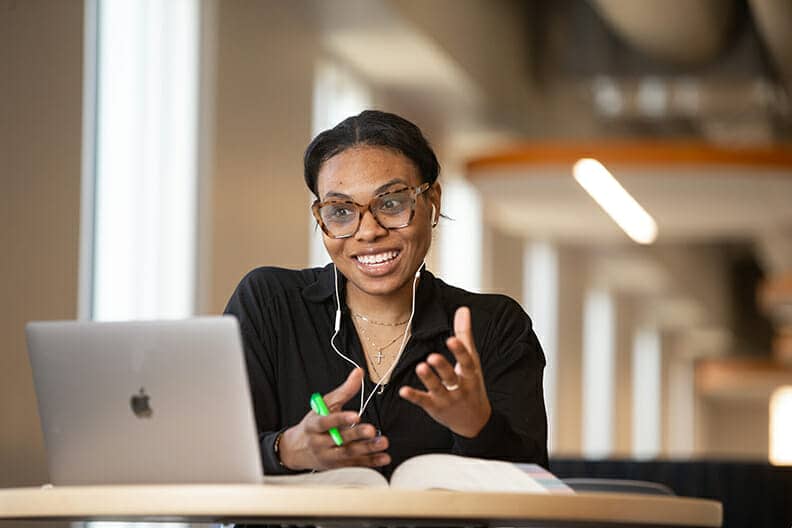 Woman sitting at computer