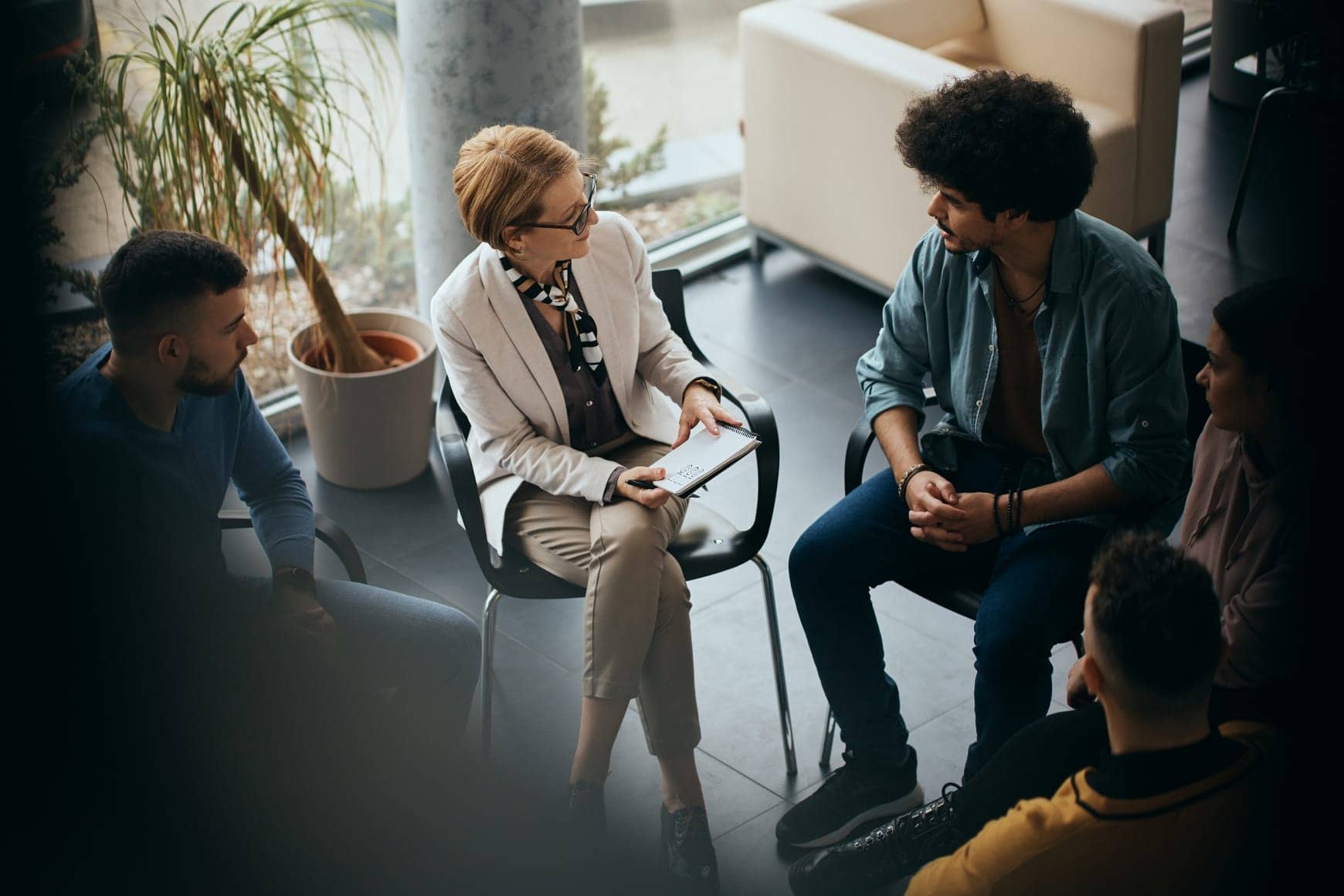 substance abuse counselor in group session with clients