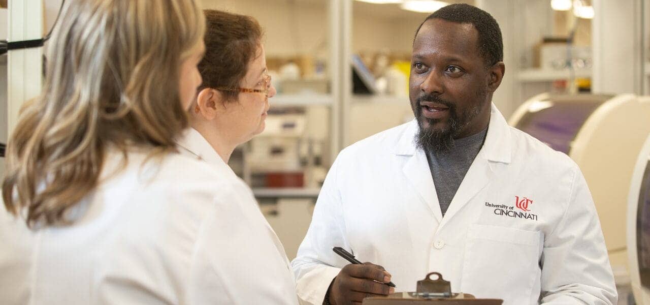 High Complexity Lab Director addressing others in the lab