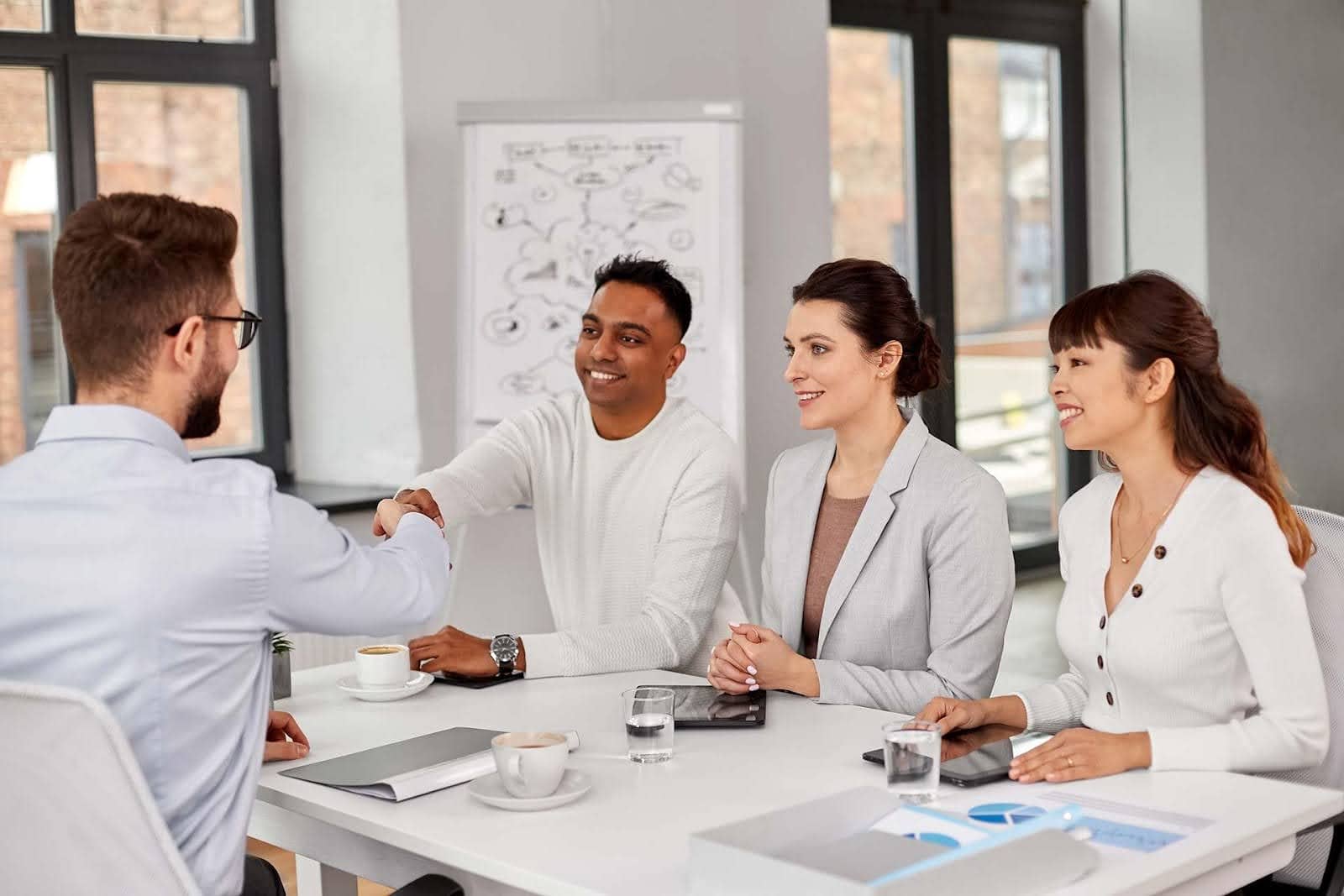 Communication professionals interviewing a job candidate