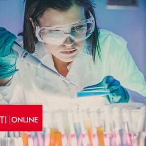 Laboratory scientist working in a lab with University of Cincinnati Online