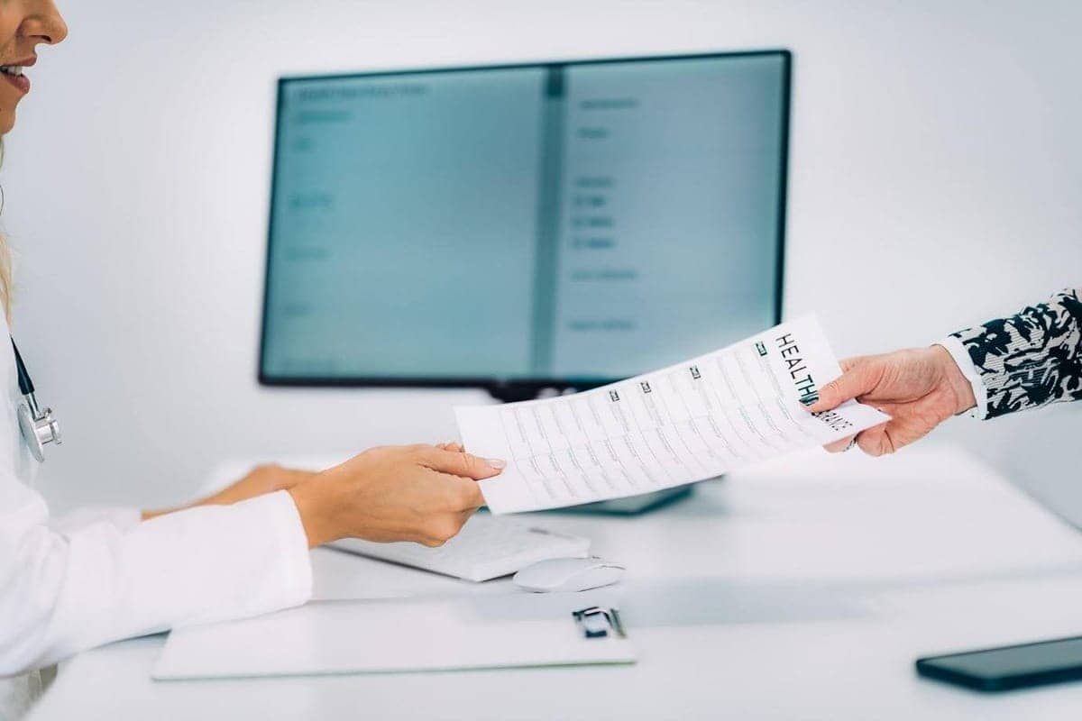 Image of a medical coder doing paperwork